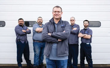 The Crew of the Car Doctor stand proudly