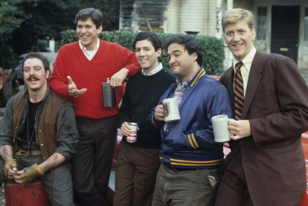 The Cast of Animal House pose for a promo photo.