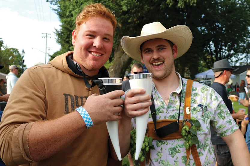 People enjoying crafted tap beer in lederhosen