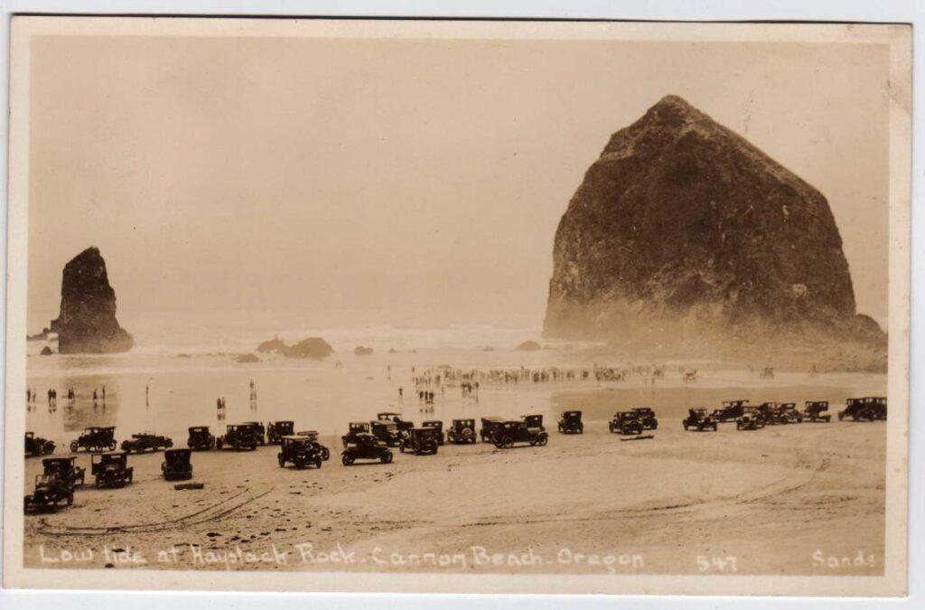 Vintage cars on the beach near haystack rock in Canon Beach