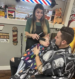 Nikki Works With A Sleeping Toddler Client at her Barbershop