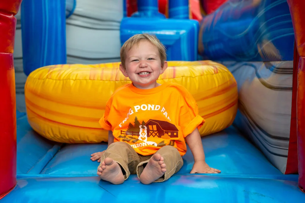 A happy Child at Frog Pond Farms