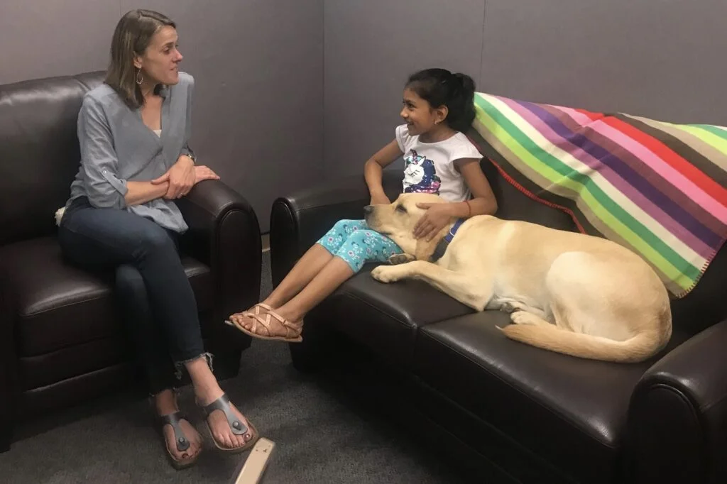 Assistance Dog MacDougal helps a child find health and well being