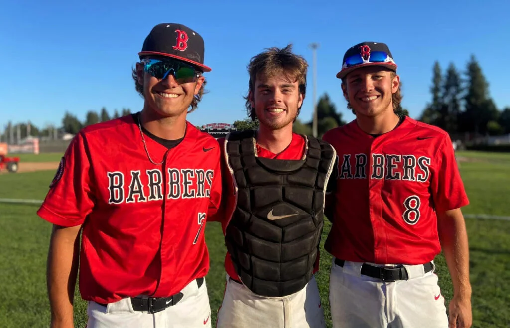 Baseball Players pose after championship game