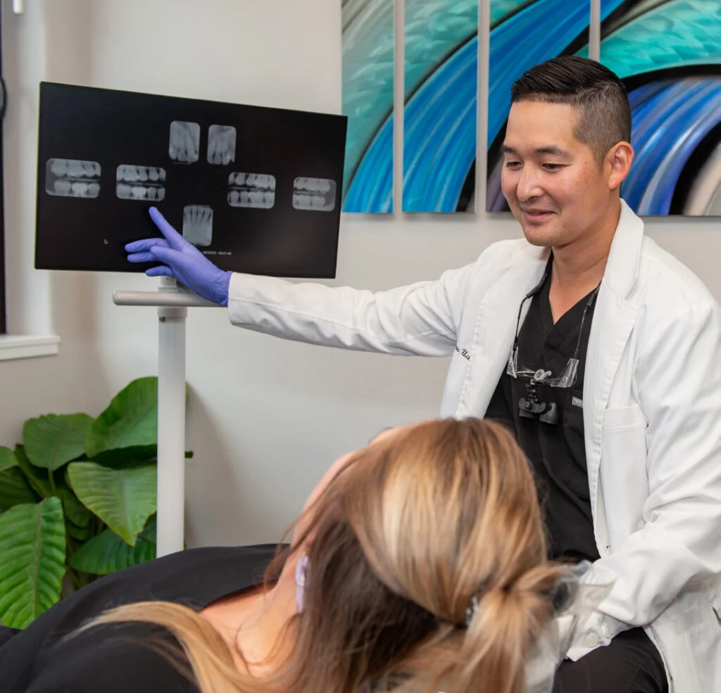 A dentist attending to a patient