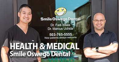 The Dentists stand in front of the business door