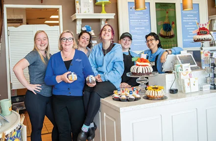 The smiling staff at Nothing Bundt Cake